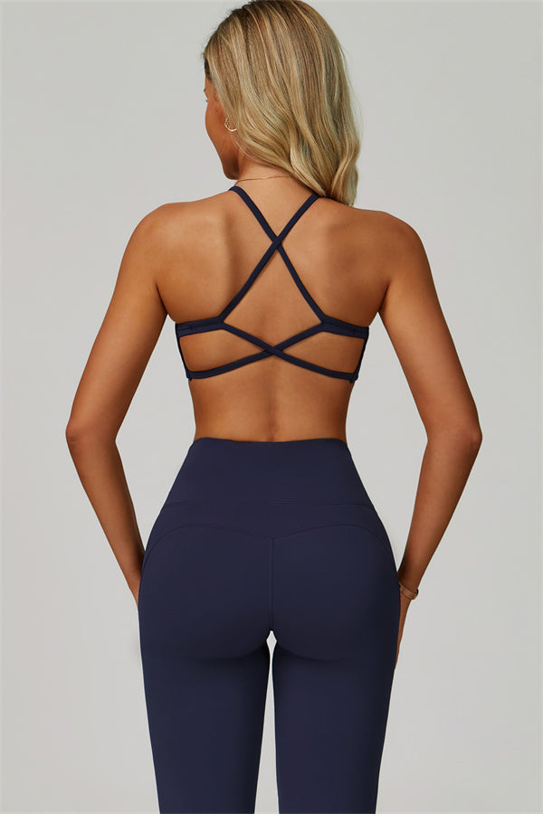 Conjunto de 2 piezas de sujetador deportivo atrevido con espalda cruzada y leggings acampanados