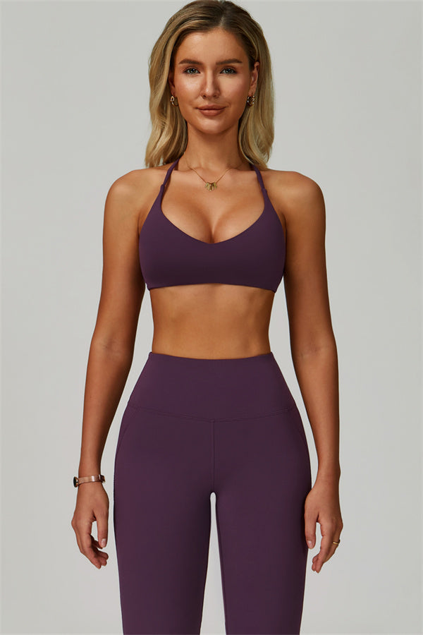 Conjunto de 2 piezas de sujetador deportivo atrevido con espalda cruzada y leggings acampanados