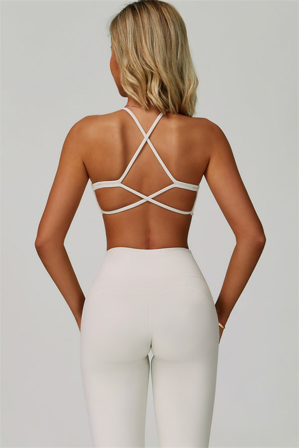 Conjunto de 2 piezas de sujetador deportivo atrevido con espalda cruzada y leggings acampanados