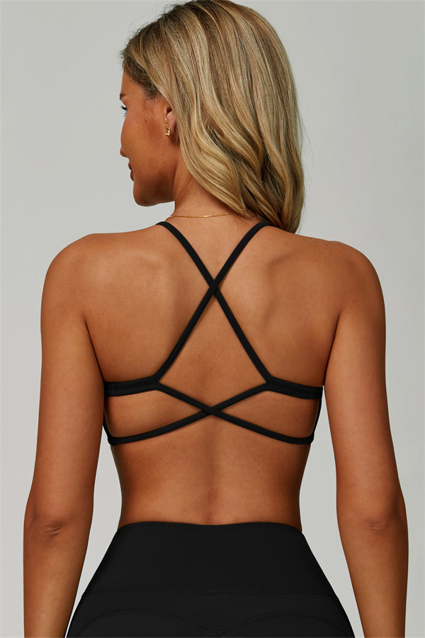 Conjunto de 2 piezas de sujetador deportivo atrevido con espalda cruzada y leggings acampanados