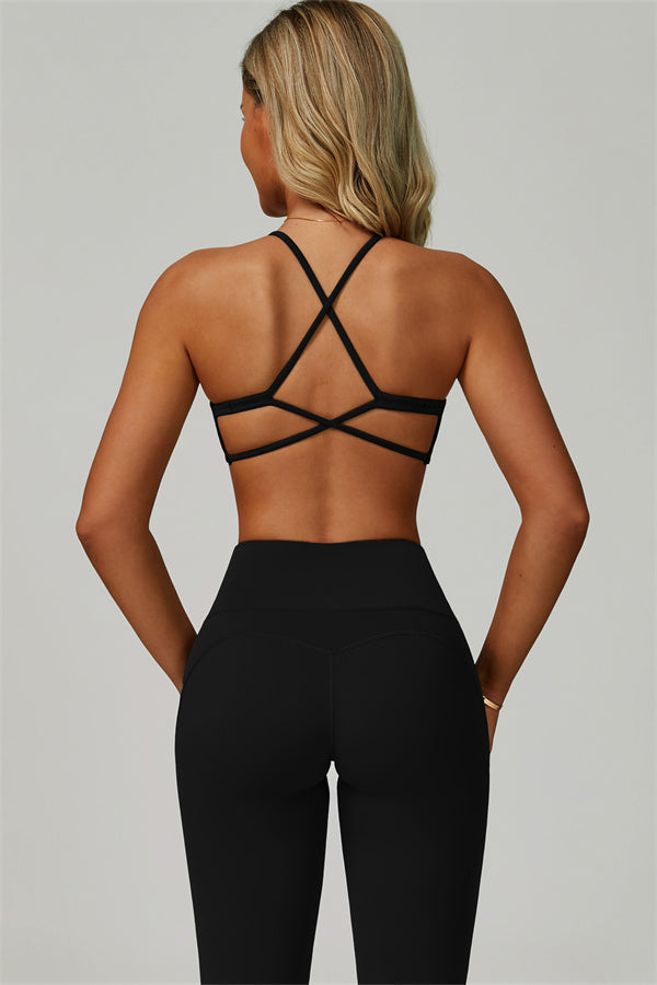 Conjunto de 2 piezas de sujetador deportivo atrevido con espalda cruzada y leggings acampanados