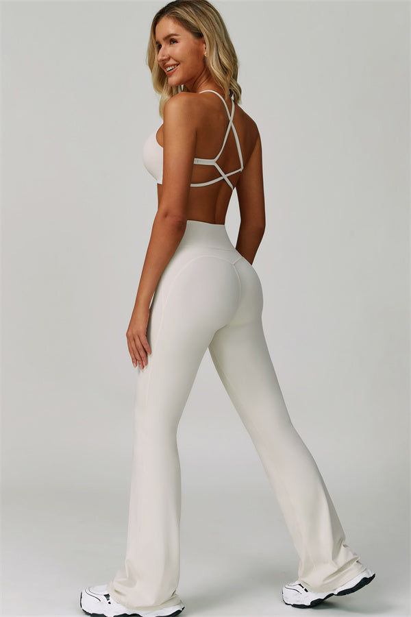 Conjunto de 2 piezas de sujetador deportivo atrevido con espalda cruzada y leggings acampanados